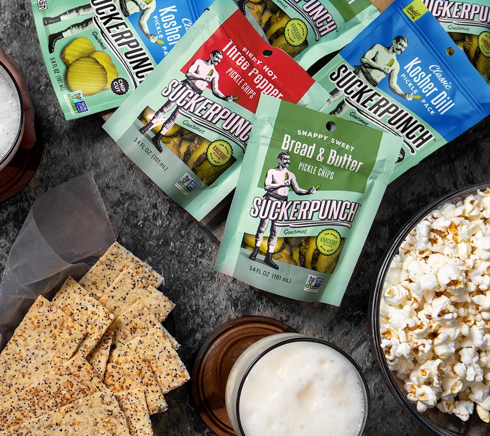 
                  
                    Pickles-Bread & Butter Chips Snack Pack von SuckerPunch ☆ Klassische Pickles in feinen Scheiben ☆ Ideal zum Burger oder für unterwegs
                  
                